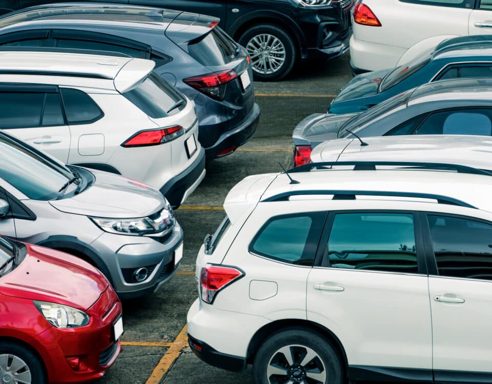 Car parked at parking lot of the airport for rental. Aerial view of car parking lot of the airport. Used luxury car for sale and rental service. Automobile parking space. Car dealership concept.